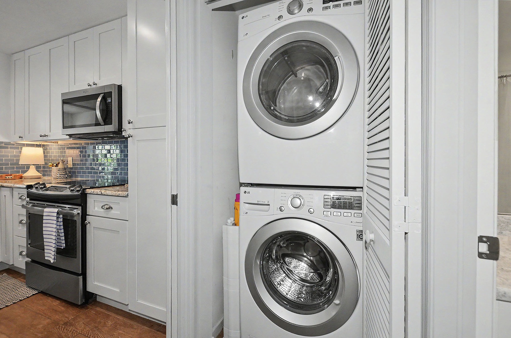 Laundry closet with stacked washer and dryer.
