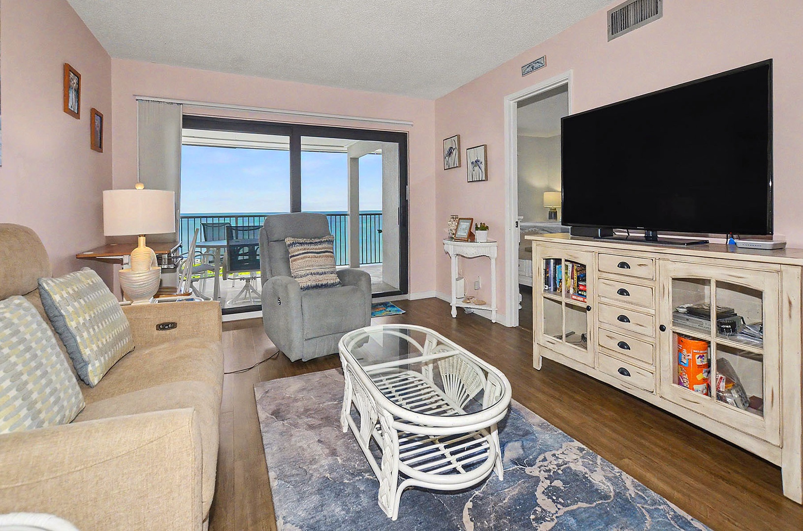 Living Room with flat screen TV & direct Balcony access