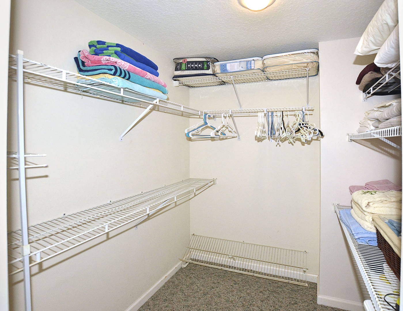 Your spacious walk-in closet features plenty of storage with wire shelving and hanging space for all your vacation wardrobe essentials.