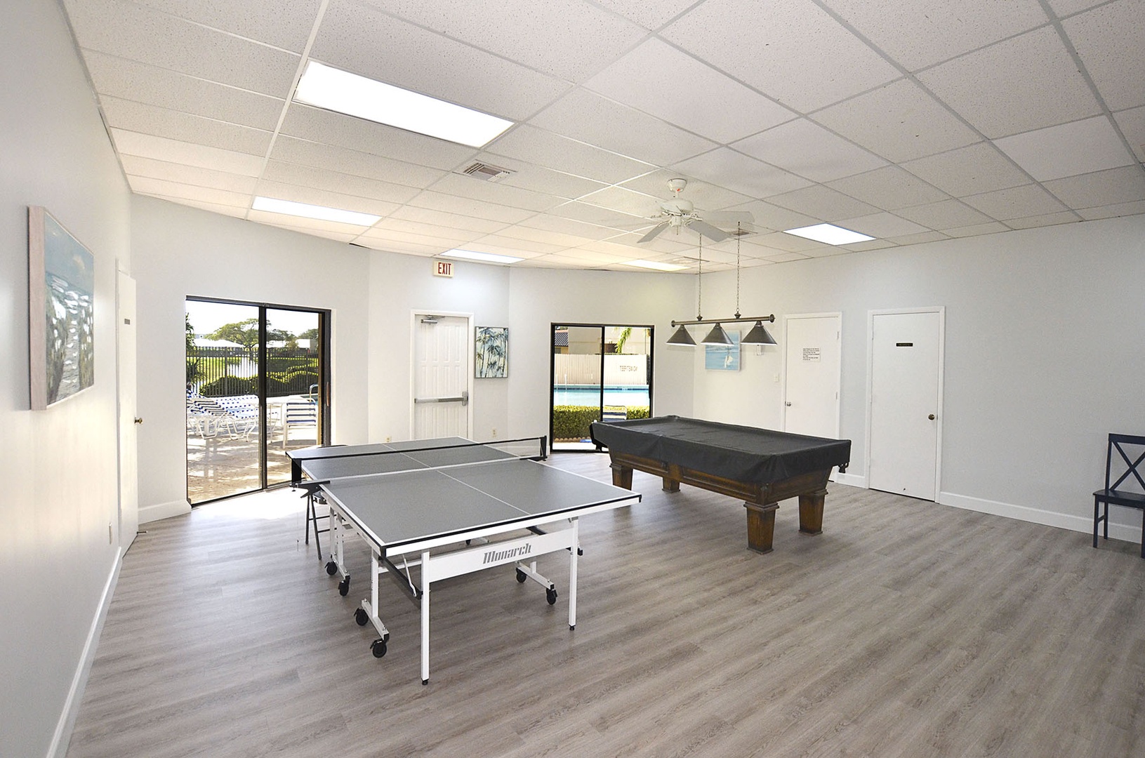 Challenge friends to ping pong or pool in your bright game room, with natural light streaming through windows overlooking the outdoor amenities.