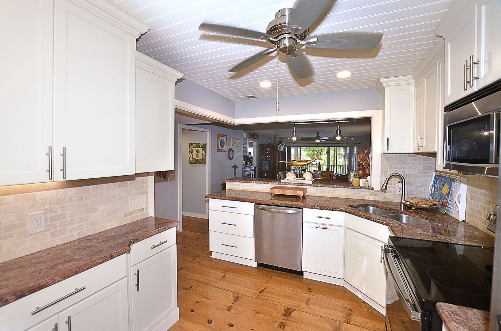 Kitchen. Your fully equipped kitchen features granite counters, stainless appliances, and an open flow perfect for cooking memorable meals during your stay.