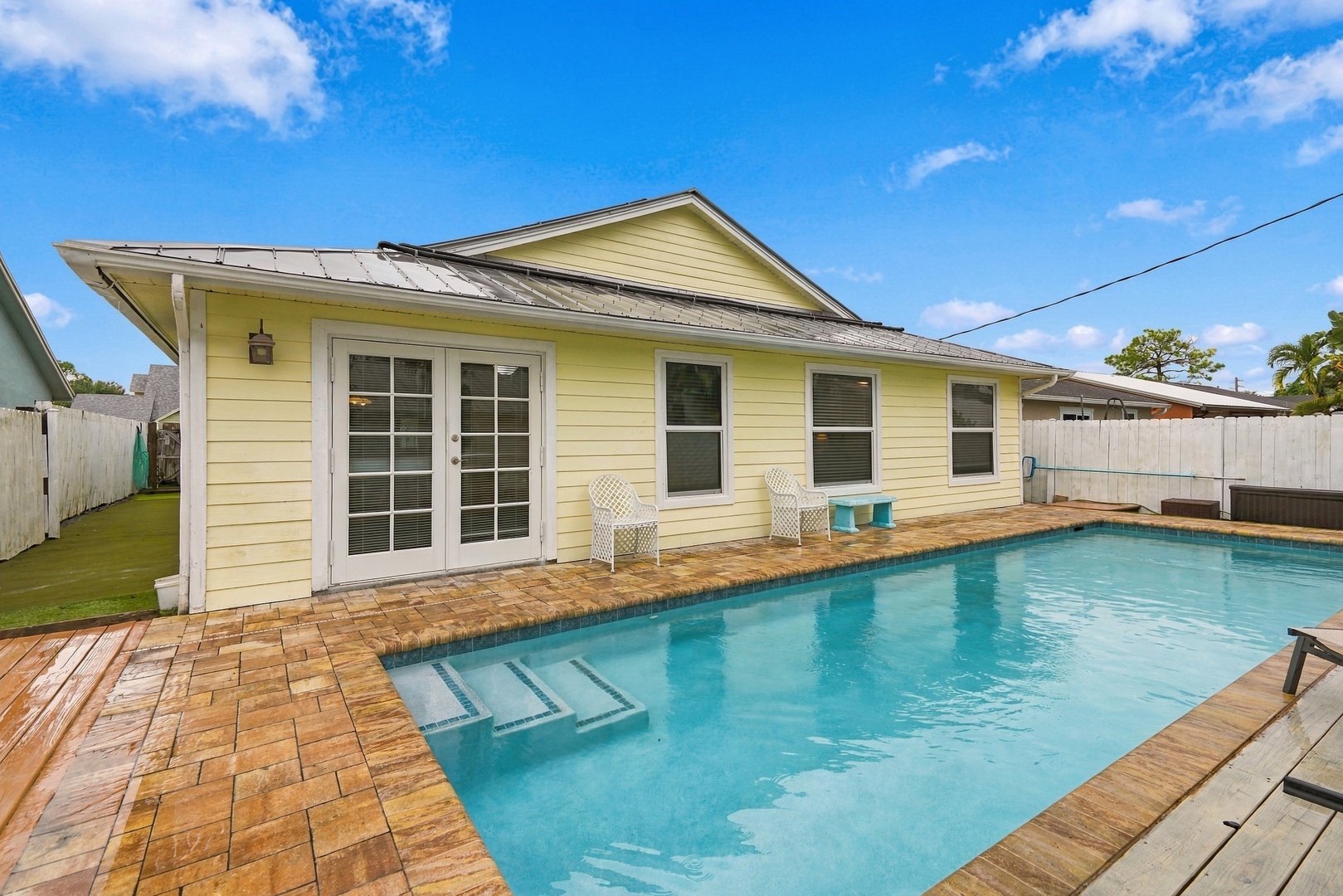Swimming Pool in private fenced rear yard.