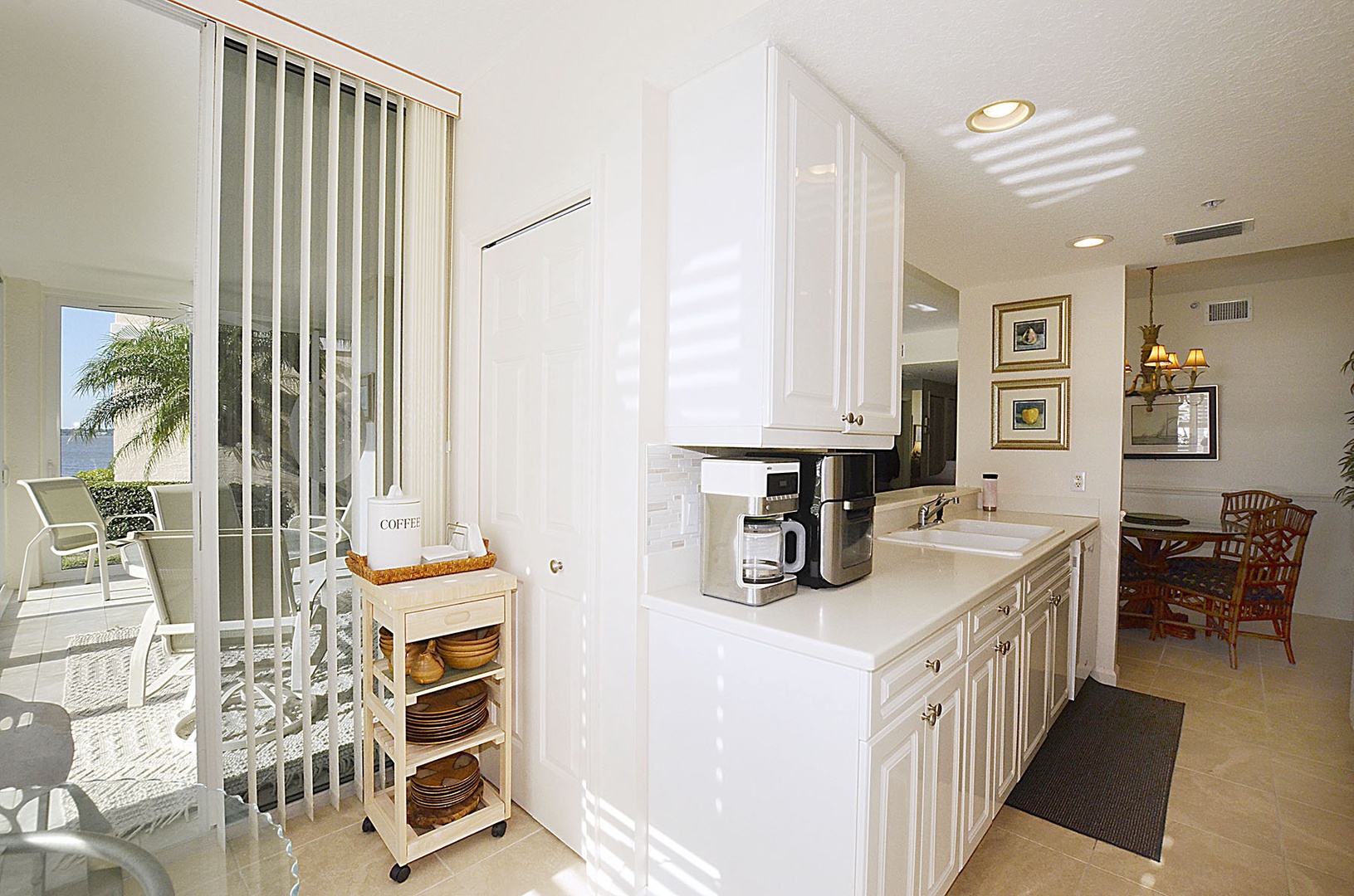 The Kitchen awaits, fully equipped with coffee maker, microwave, and everything you need to start each day right.