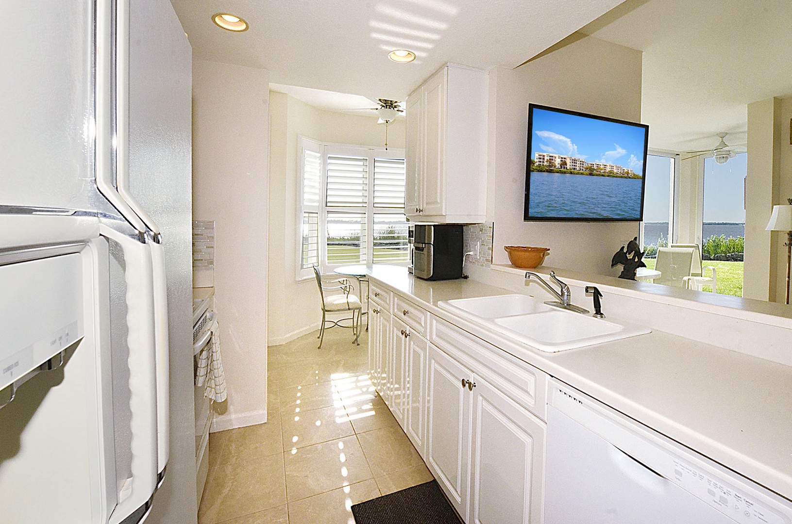 Cook with ease in your bright, fully equipped kitchen featuring modern appliances and stunning waterfront views.
