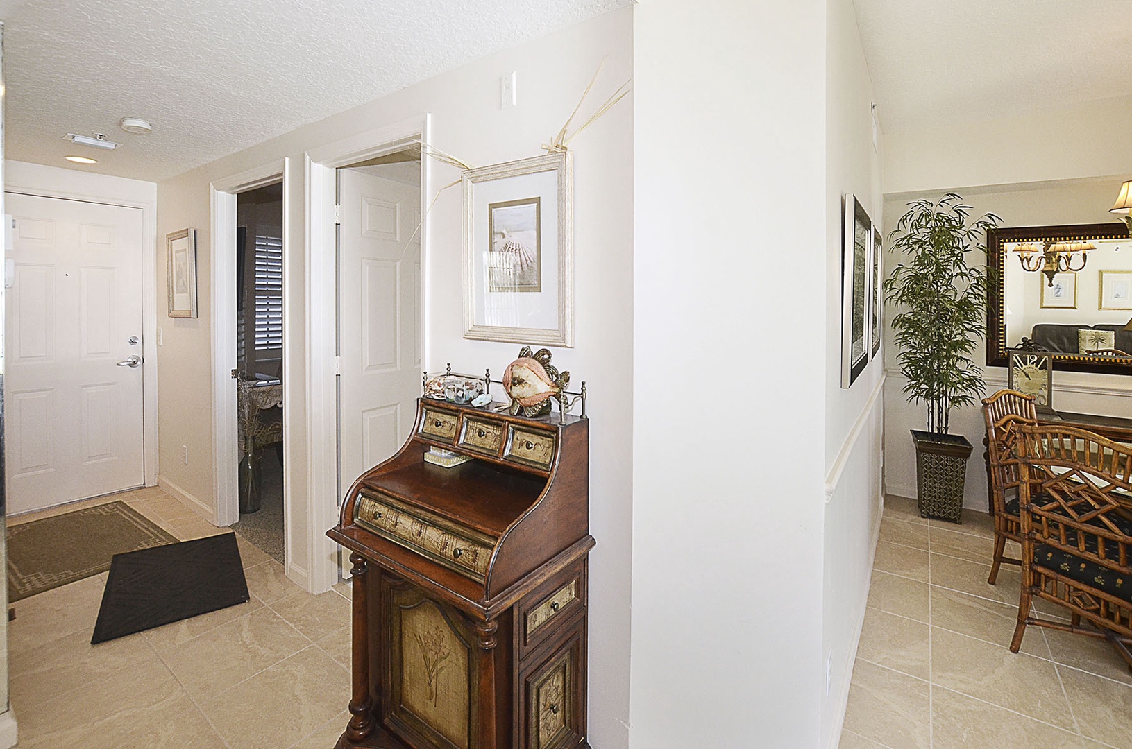 Step into your inviting residence foyer with polished tile floors and charming nautical touches that set a coastal tone.