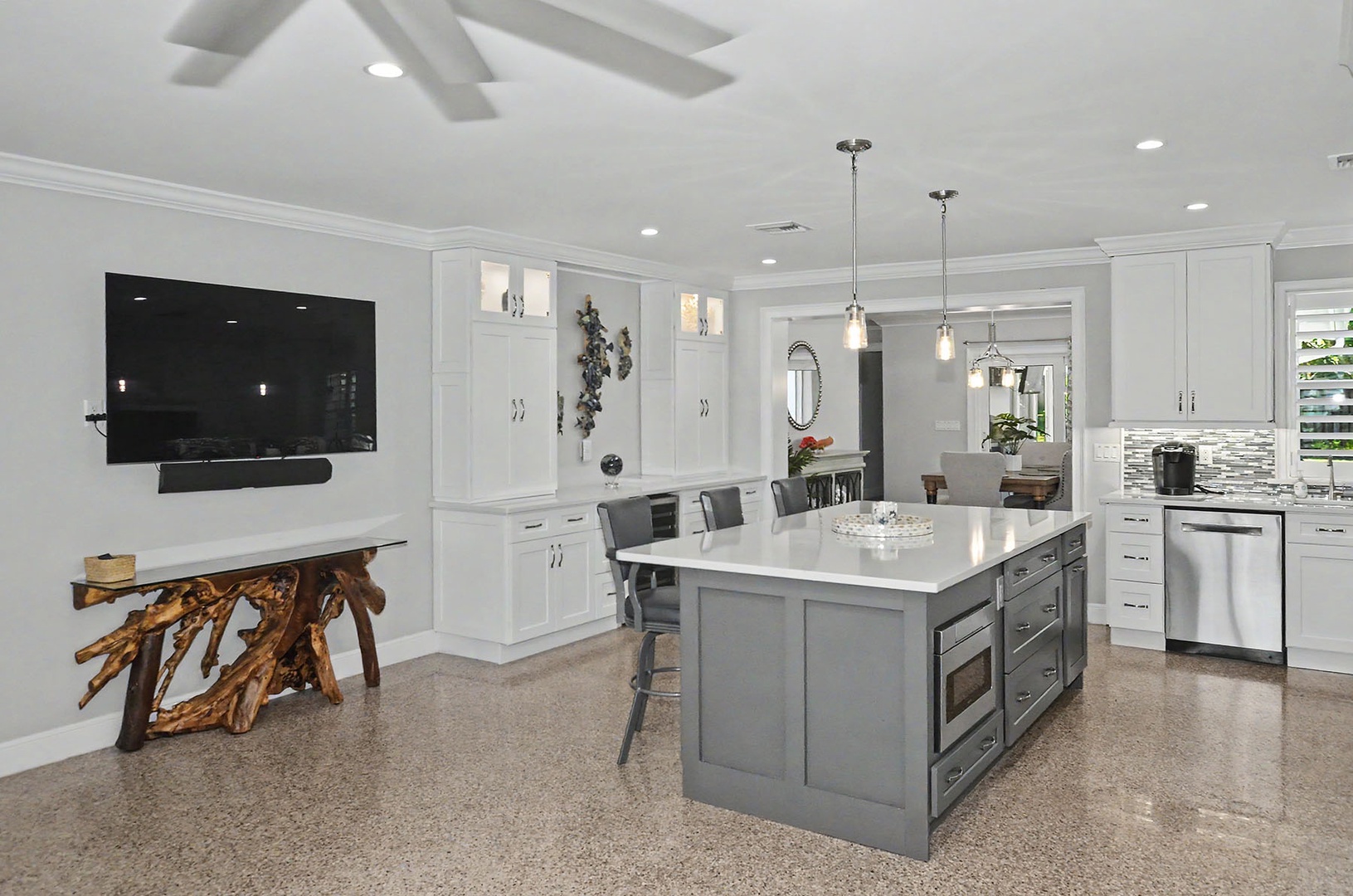 Kitchen with large center island & bar stools