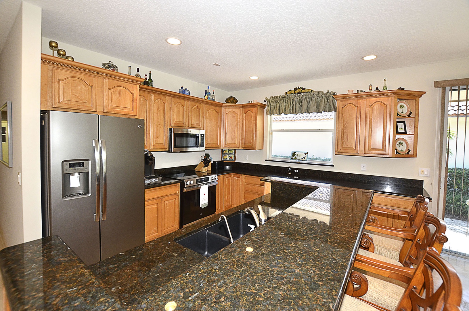 Kitchen with granite counter tops & stainless steel appliances