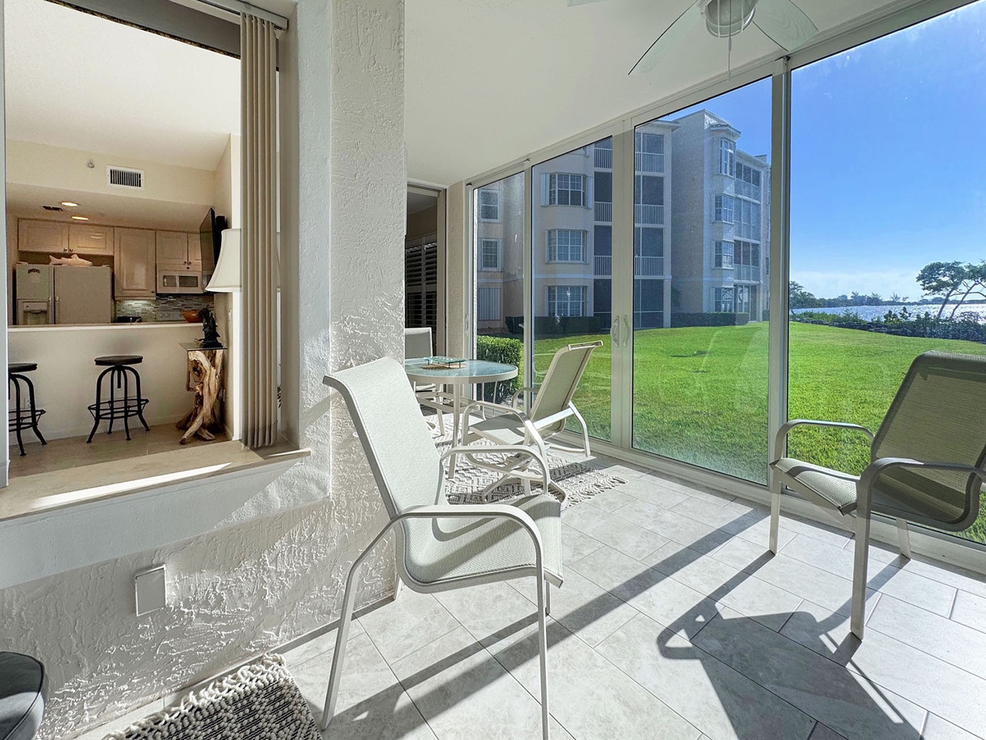 The spacious private Patio offers peaceful outdoor dining with panoramic views of manicured lawns & the wide water of the Intracoastal Waterway.