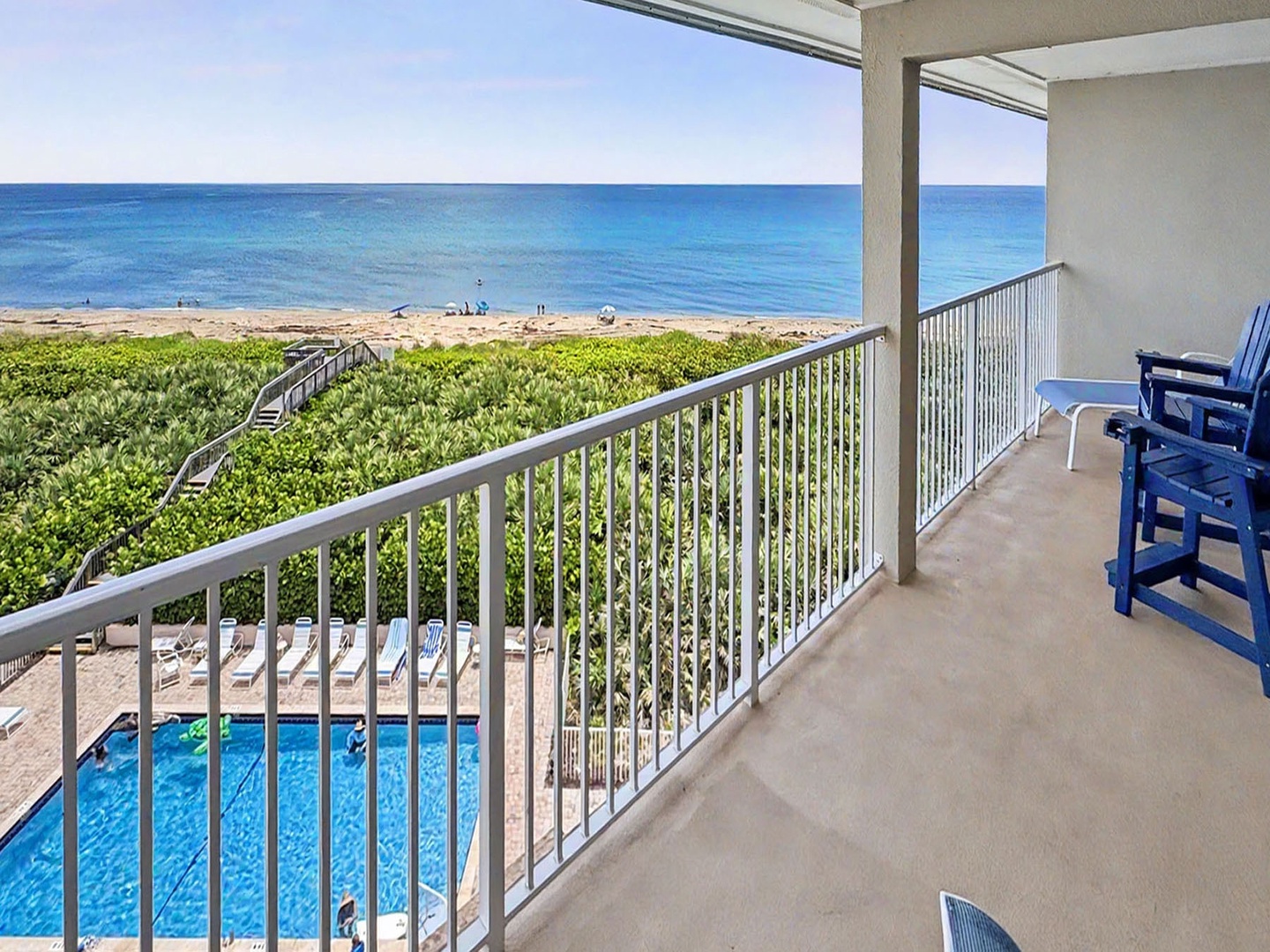 Balcony View overlooking the community swimming pool and oceanfront