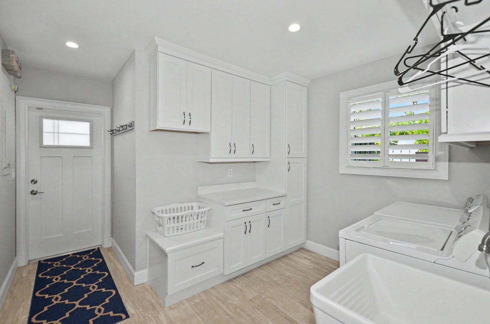 Laundry Room with generous counter & storage space
