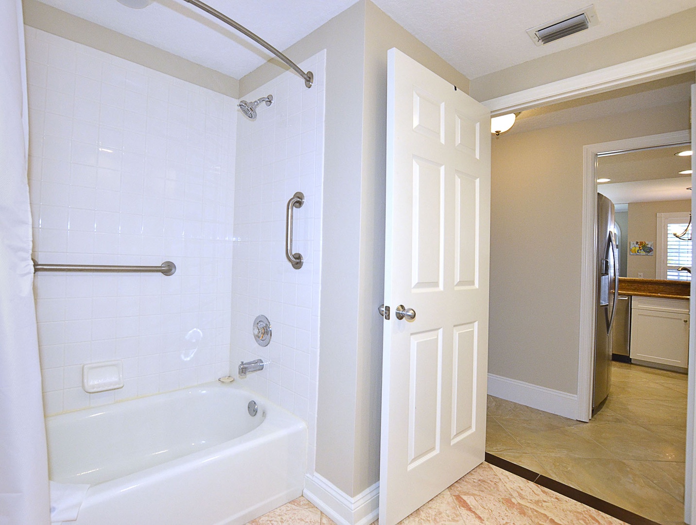 Guest bath features a tub / shower combination.