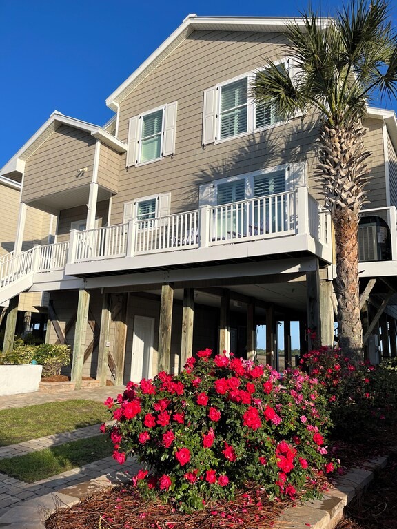 front of house with flowers