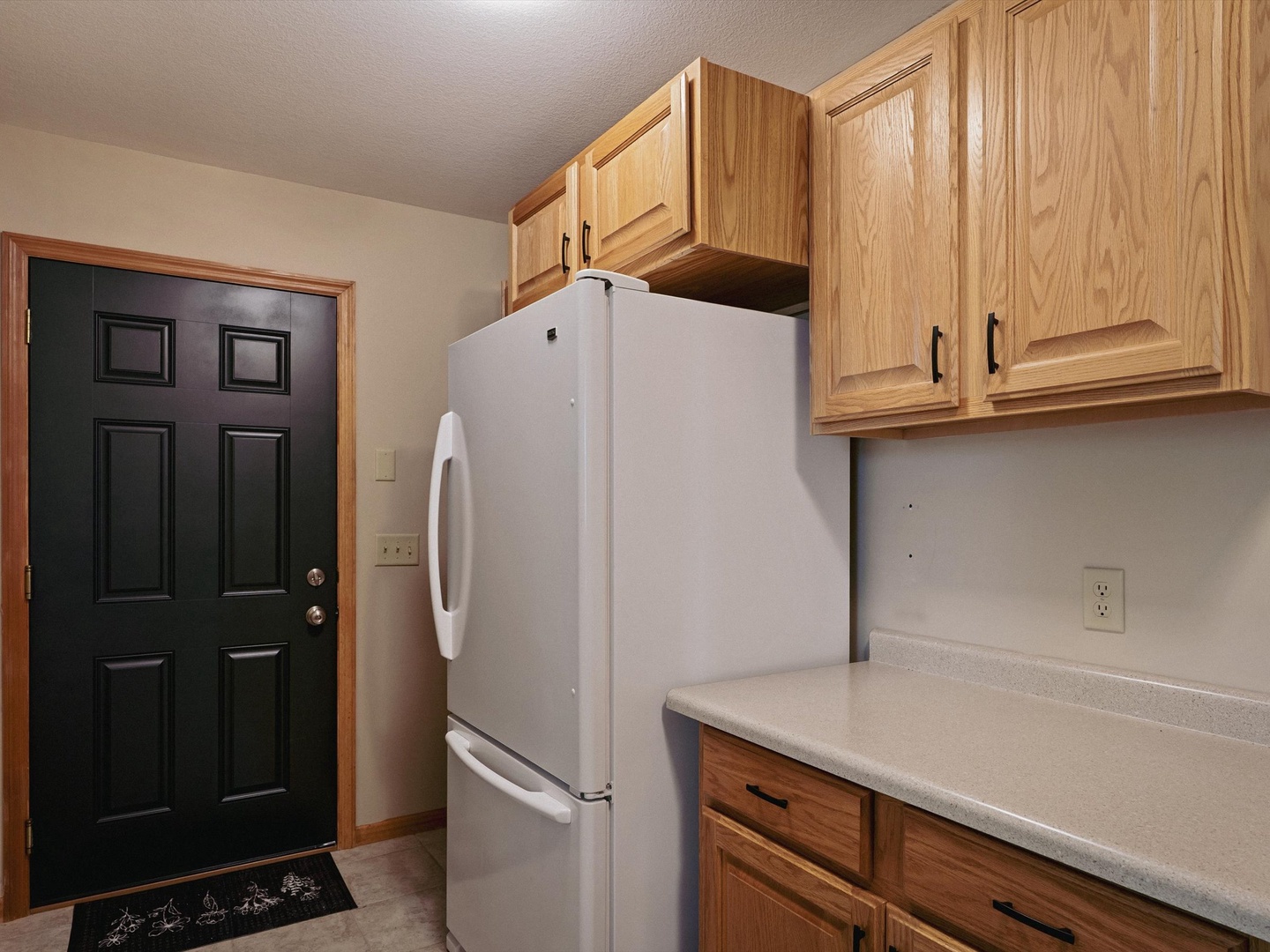 Extra fridge in main level laundry room.