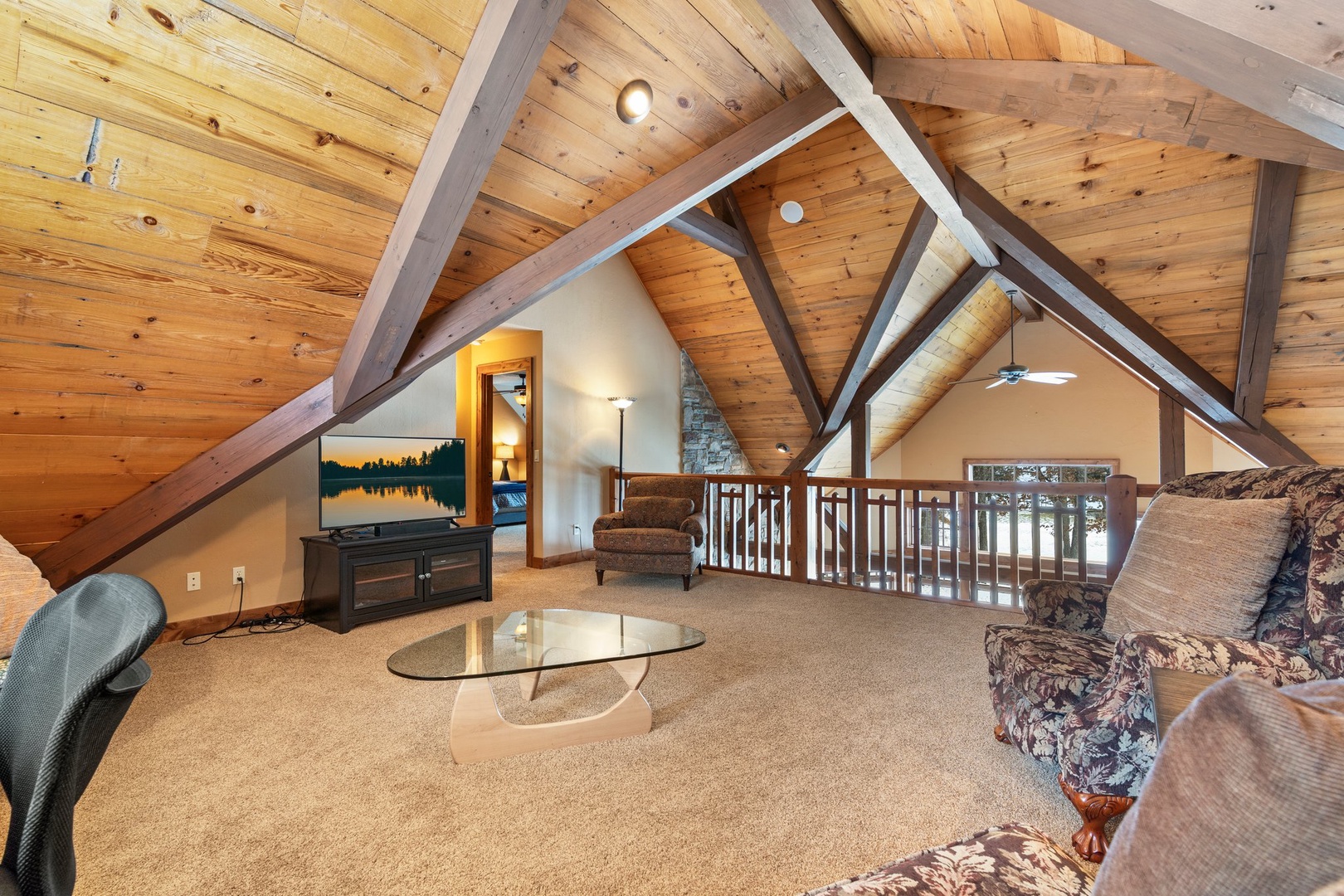 Relax in your private loft retreat with soaring wood-beam ceilings and cozy seating perfect for unwinding.