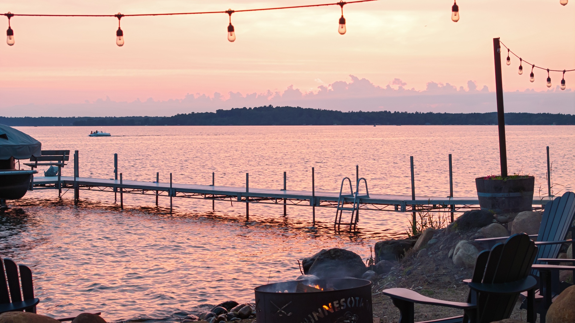 Dock view from fire pit at sunset on Gull Lake.