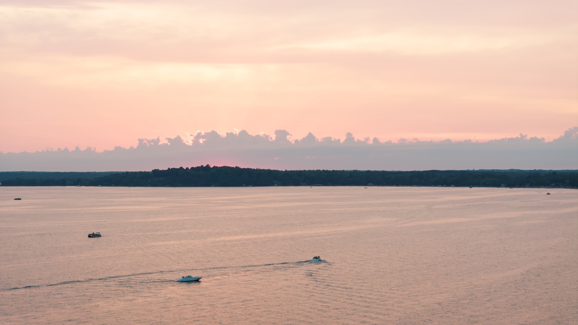 Aerial view of boats on Gull Lake at sunset.