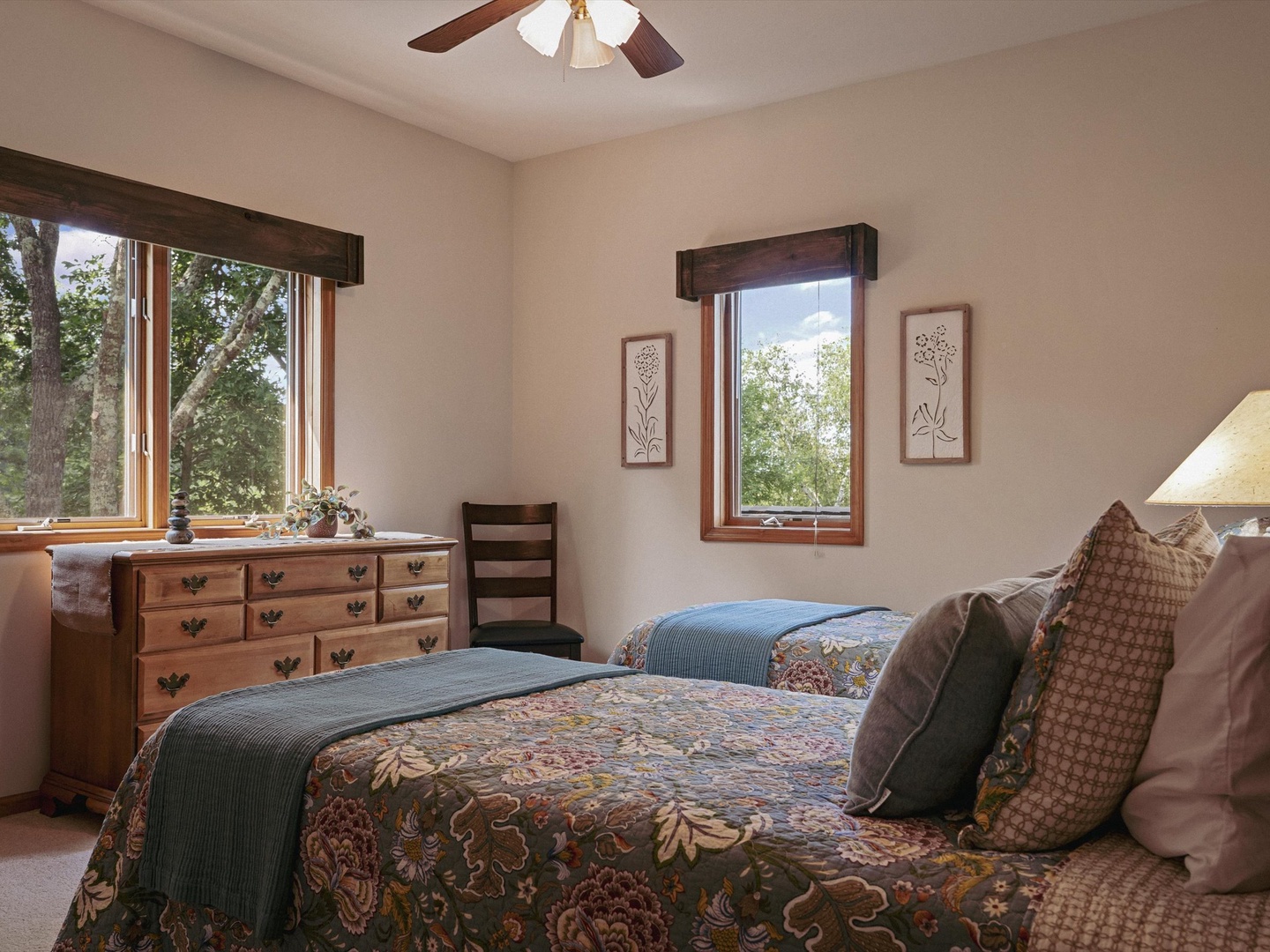 Upper level bedroom with two twin beds.