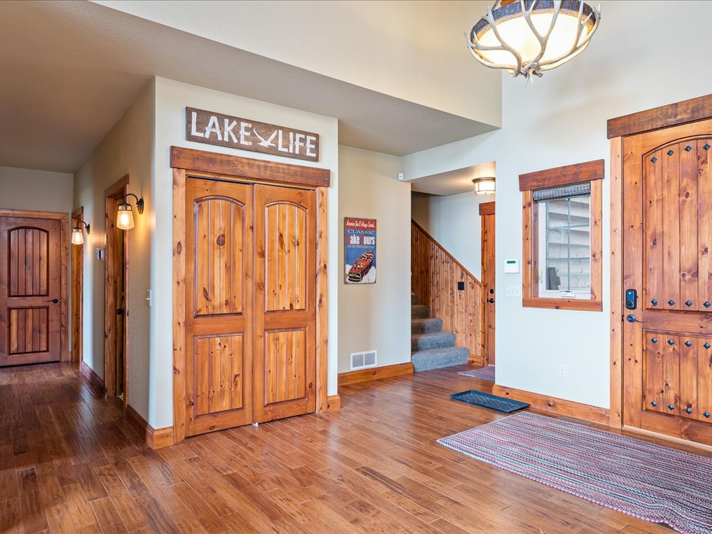 Front Entry, garage entrance and stairs to bunk room
