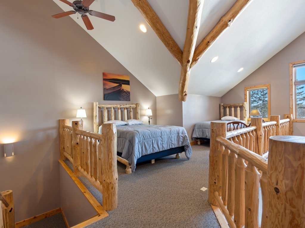 Rustic log beds Natural wood beams and warm lighting make this your perfect family retreat.