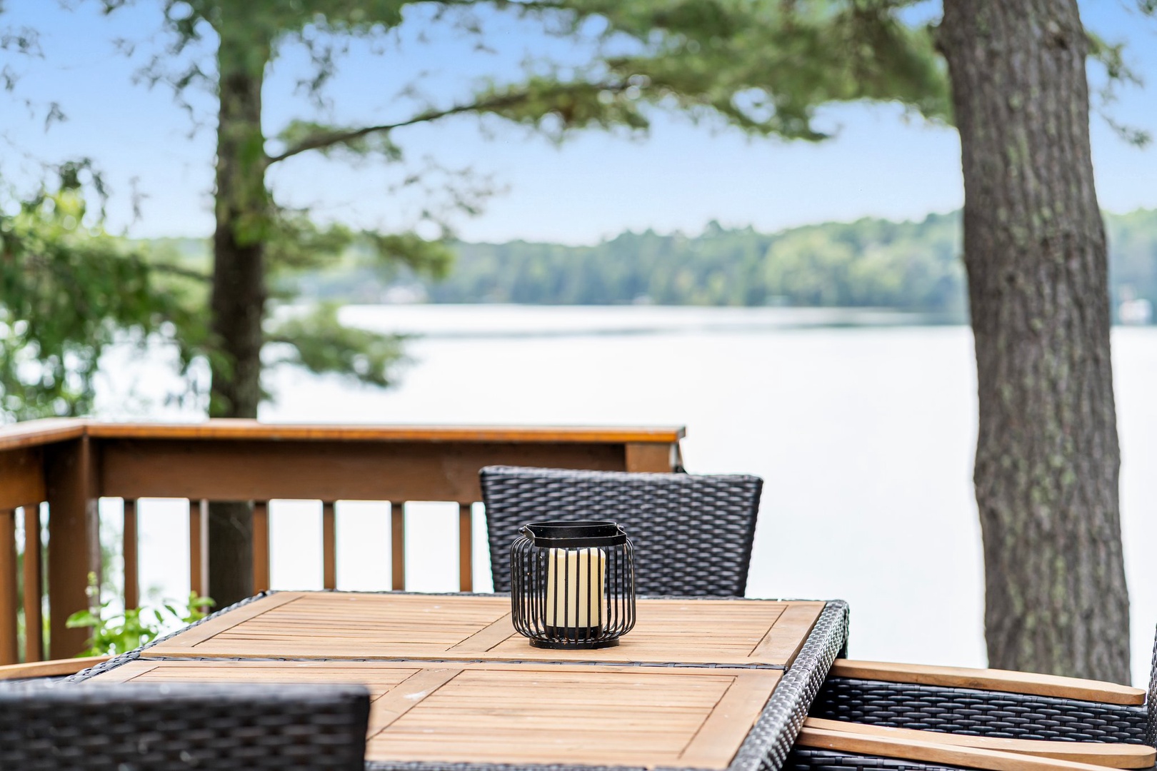 Picture yourself dining on your private deck overlooking the serene lake, where peaceful mornings and stunning views create the perfect lakeside retreat.