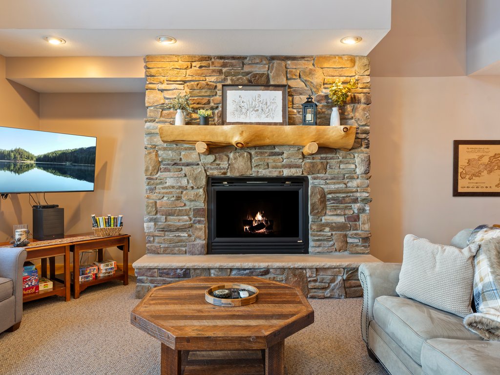 Cozy up by your stone fireplace with plush seating and entertainment center for relaxing evening/