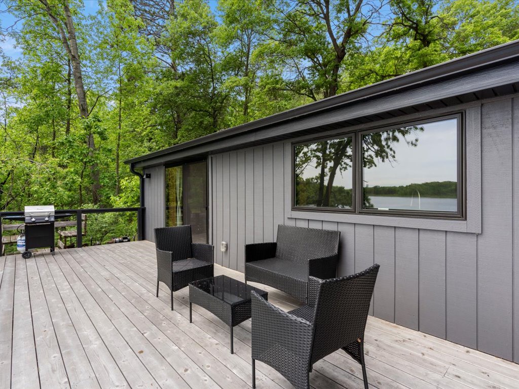 Spacious deck with comfortable seating, BBQ grill, and we do have a dining table