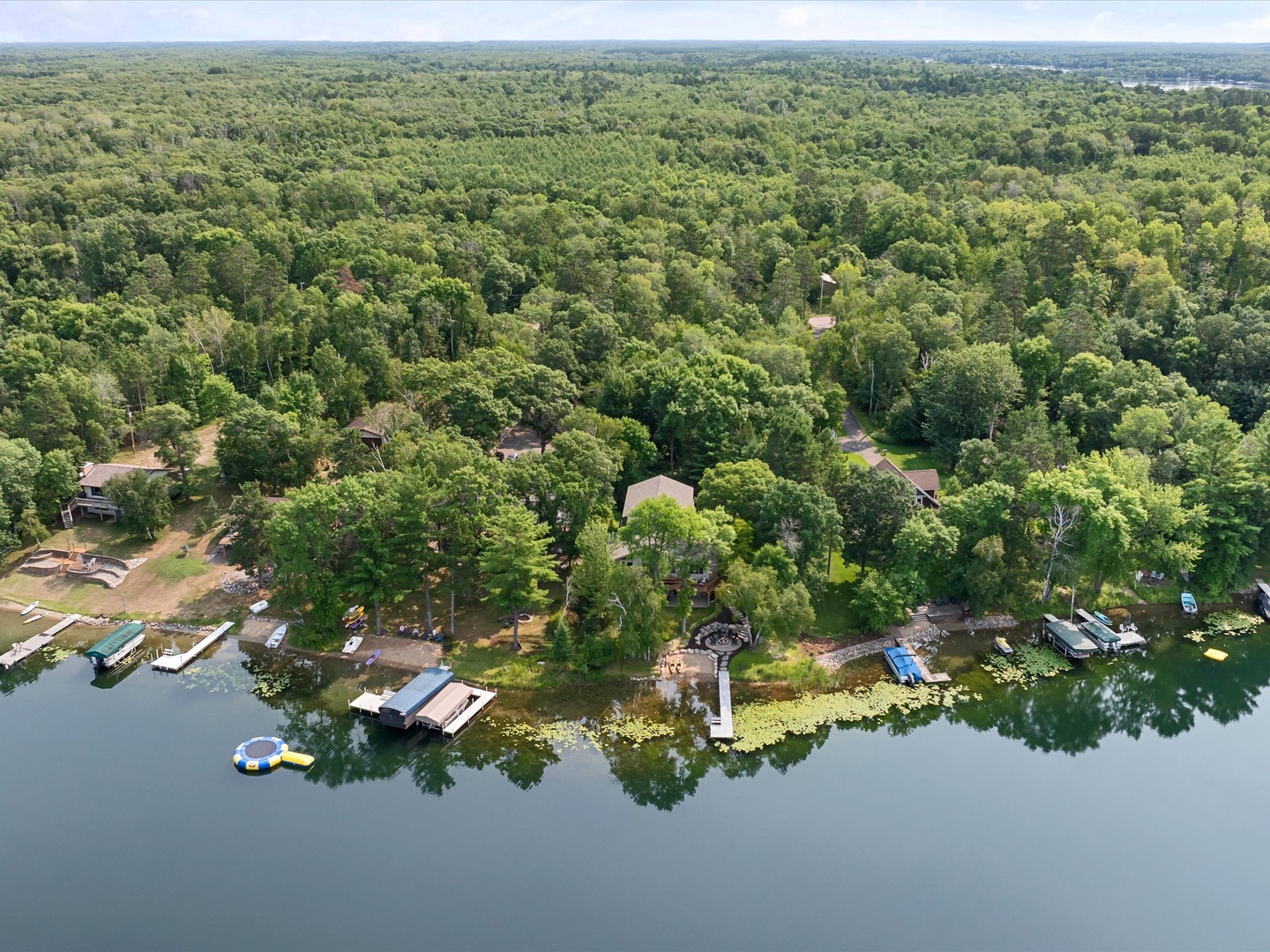 Aerial view of the property, beach and lake.