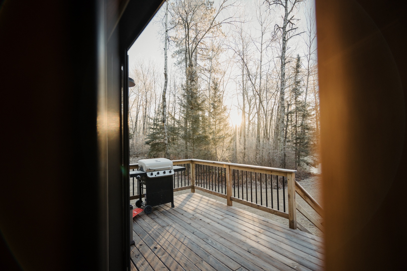 Deck with Grill and adirondeck chairs