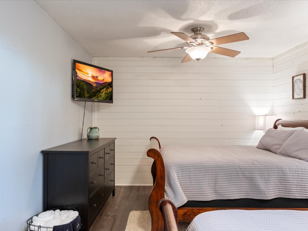 Another look into bedroom #2. Equipped with a TV and dresser