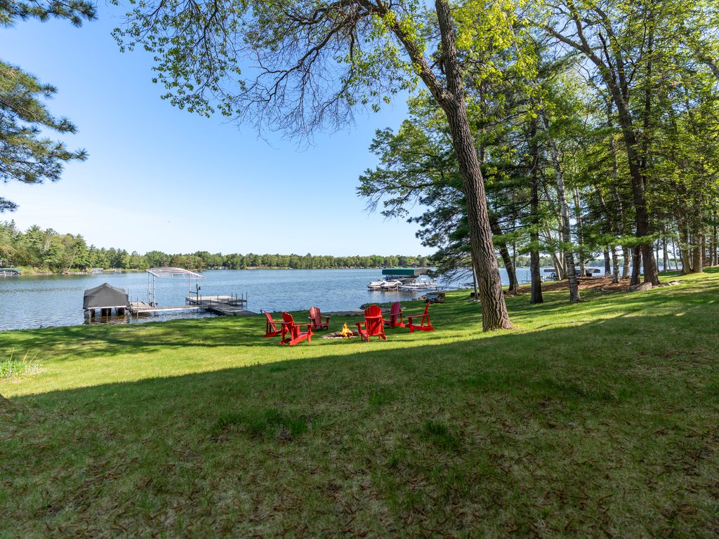 Stunning lakefront setting with private dock, Firepit and Beach