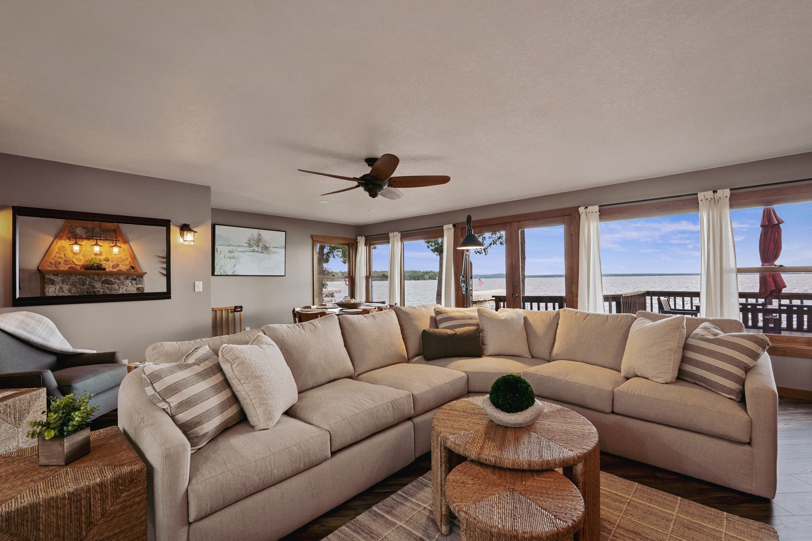 Open concept living room with large windows and natural light.