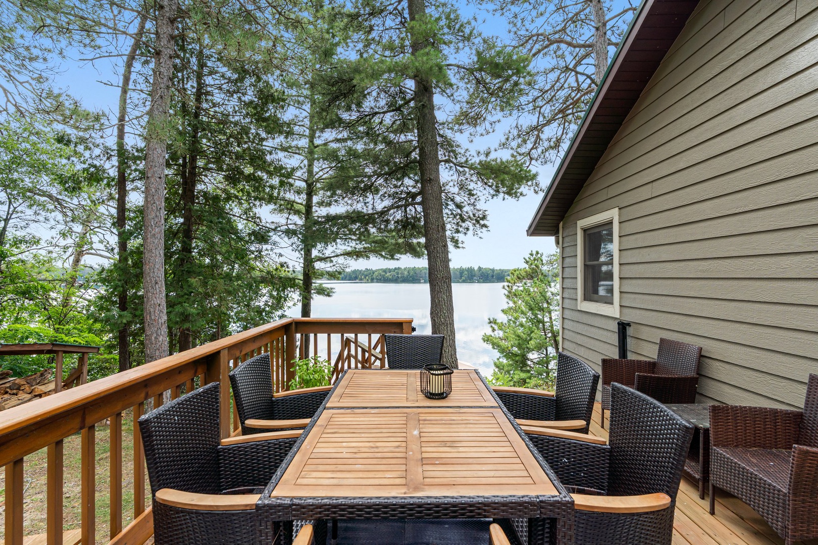 Dine al fresco on your private deck with stunning lake views through towering pines.