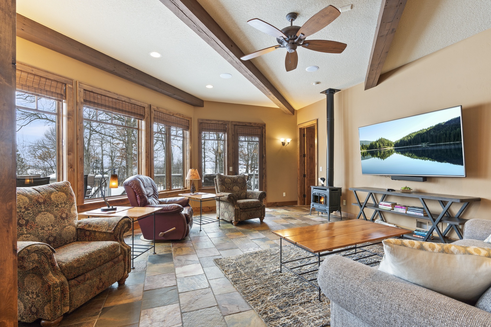 Sink into plush seating by your cozy wood stove  in this Spacious  Family space right off the dining and kitchen space