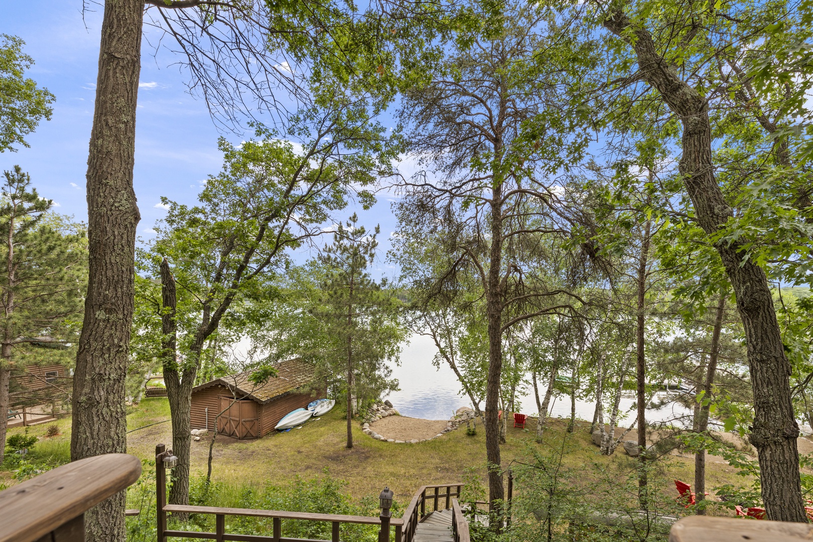 Lakefront property with private beach access and scenic waterfront views.  Property Is elevated and has stairs to the lake front