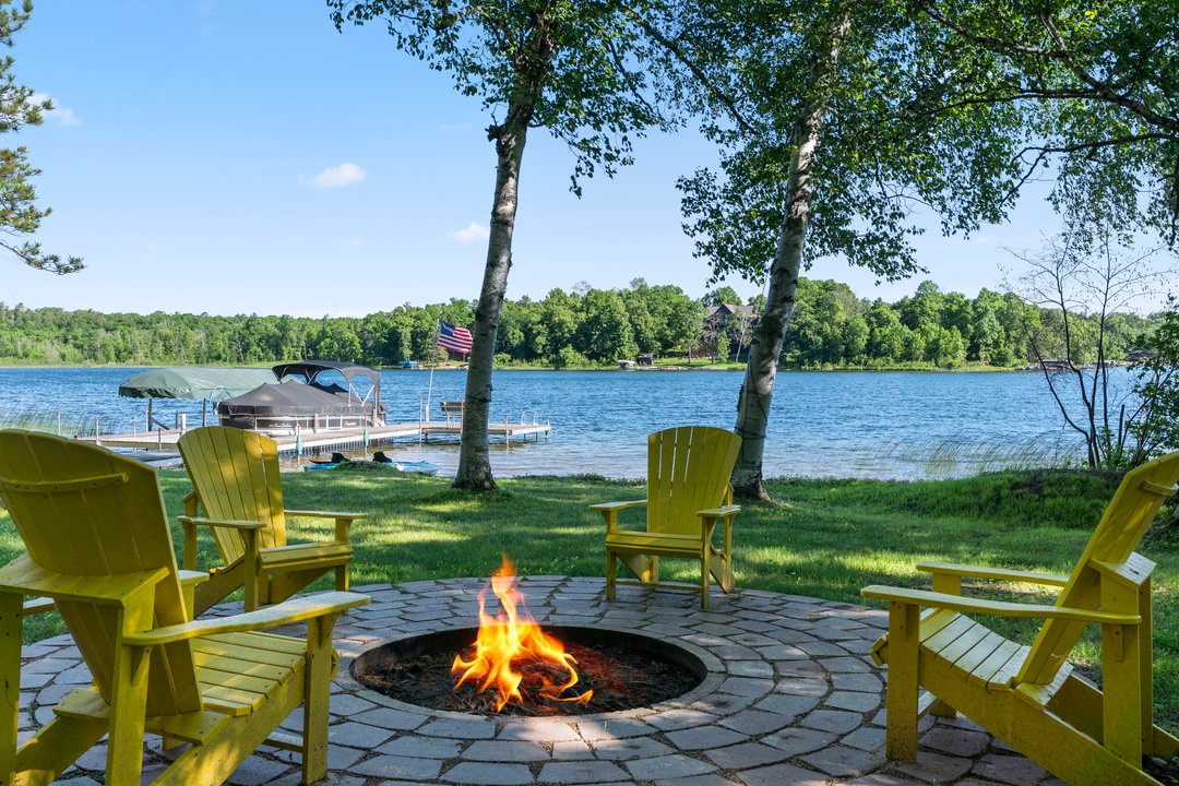 Adirondack Chairs around the firepit.  Additional camping chairs available in the boathouse.