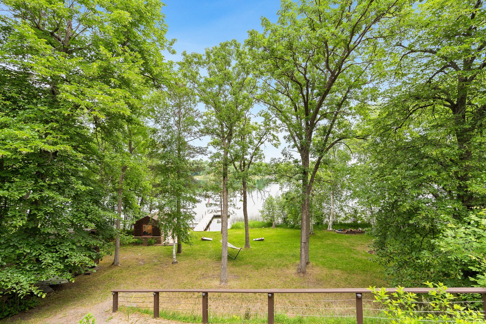 Serene lakefront setting with mature trees