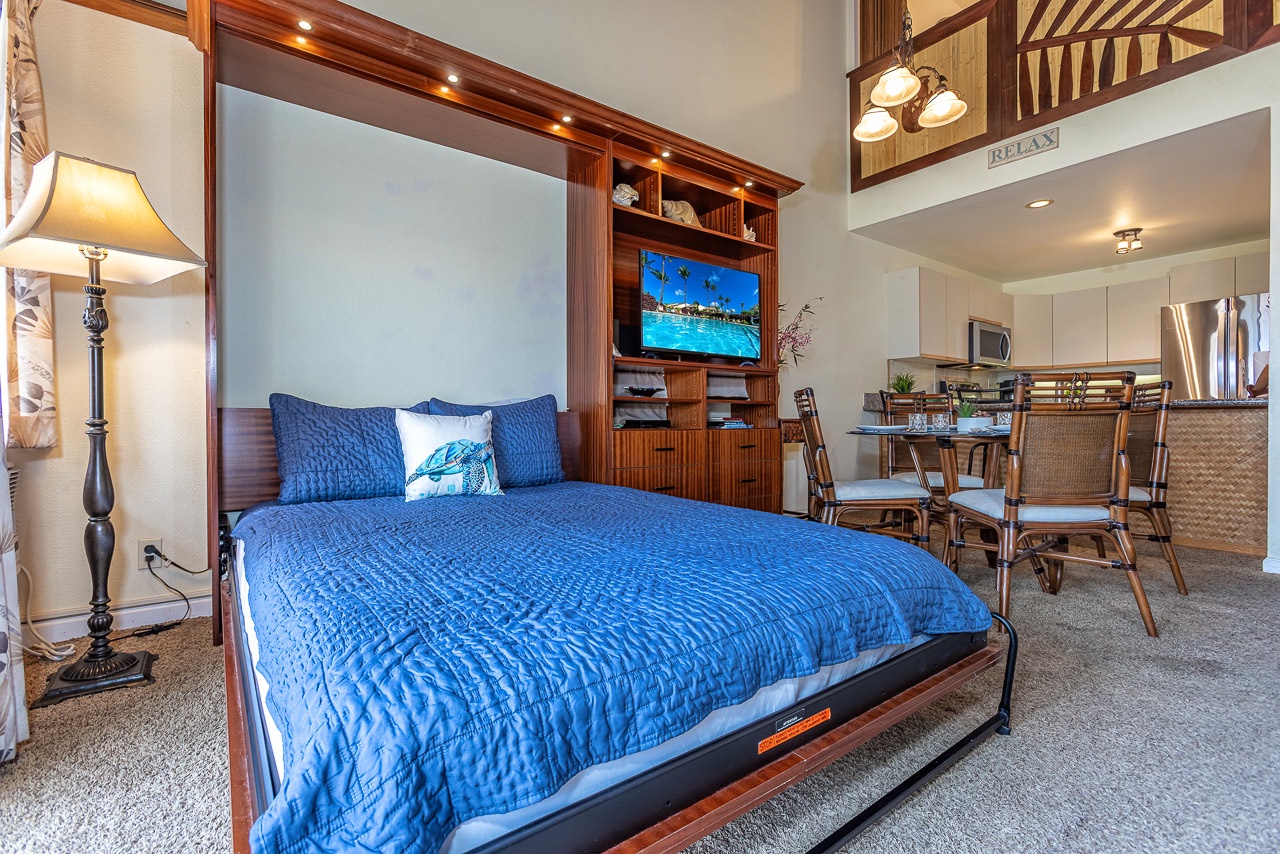 Sink into comfort in this open, airy space where your Murphy bed pulls down effortlessly after a day of exploring. The dining area invites relaxed meals, and the loft above adds extra charm to your island retreat.