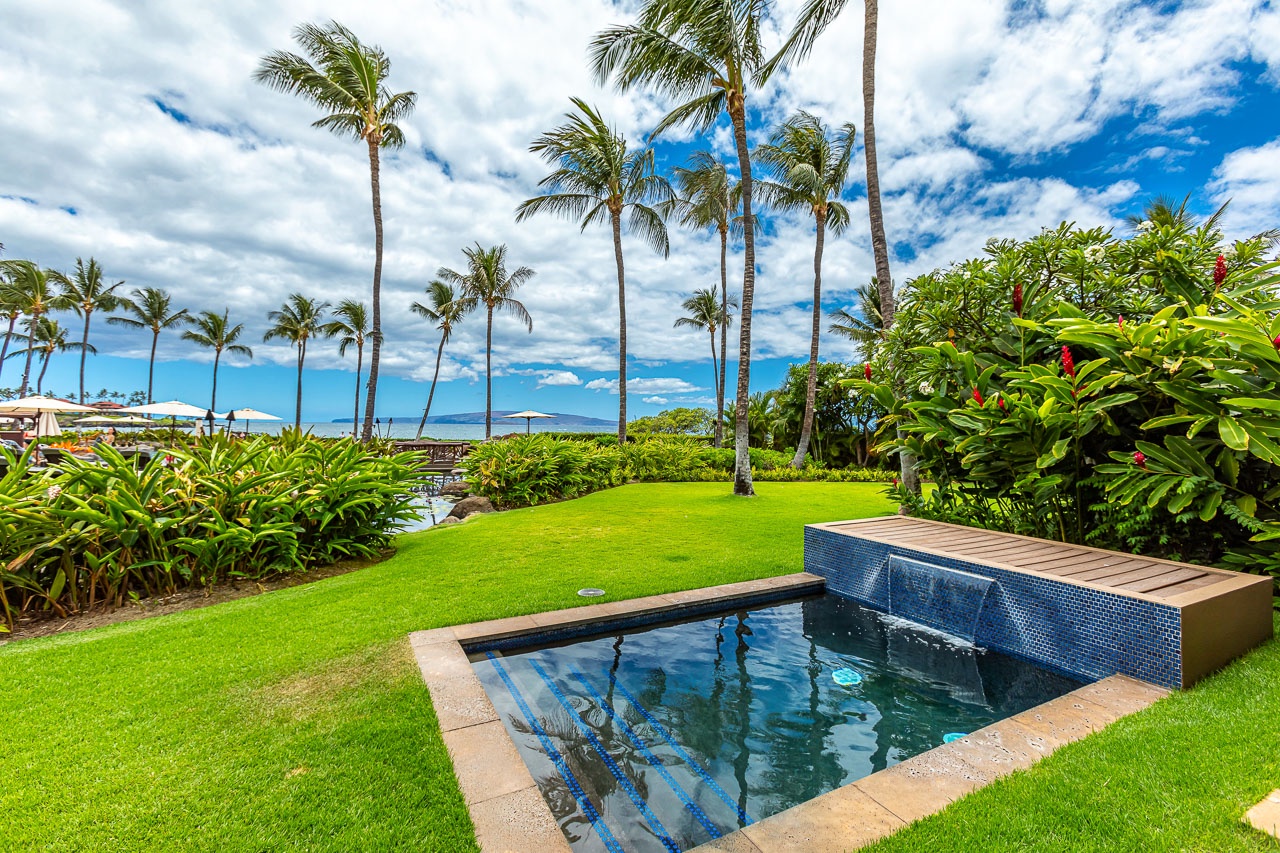A lush tropical paradise features swaying palms, vibrant landscaping, and a sparkling private pool steps from the ocean—perfect for unwinding in your own slice of Hawaiian tranquility.