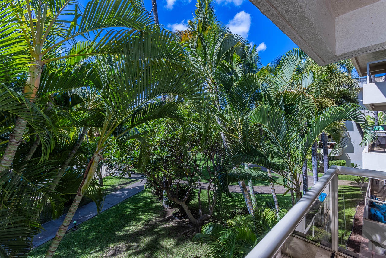 Step outside to your private lanai with tropical views