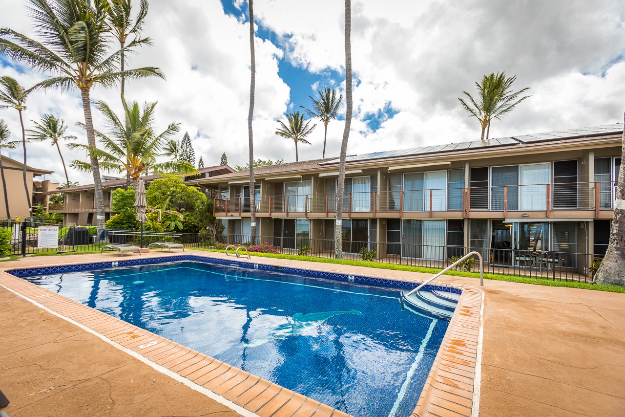 Step outside to your private oasis, where sparkling blue waters invite you to unwind beneath swaying palms and sunny Hawaiian skies.