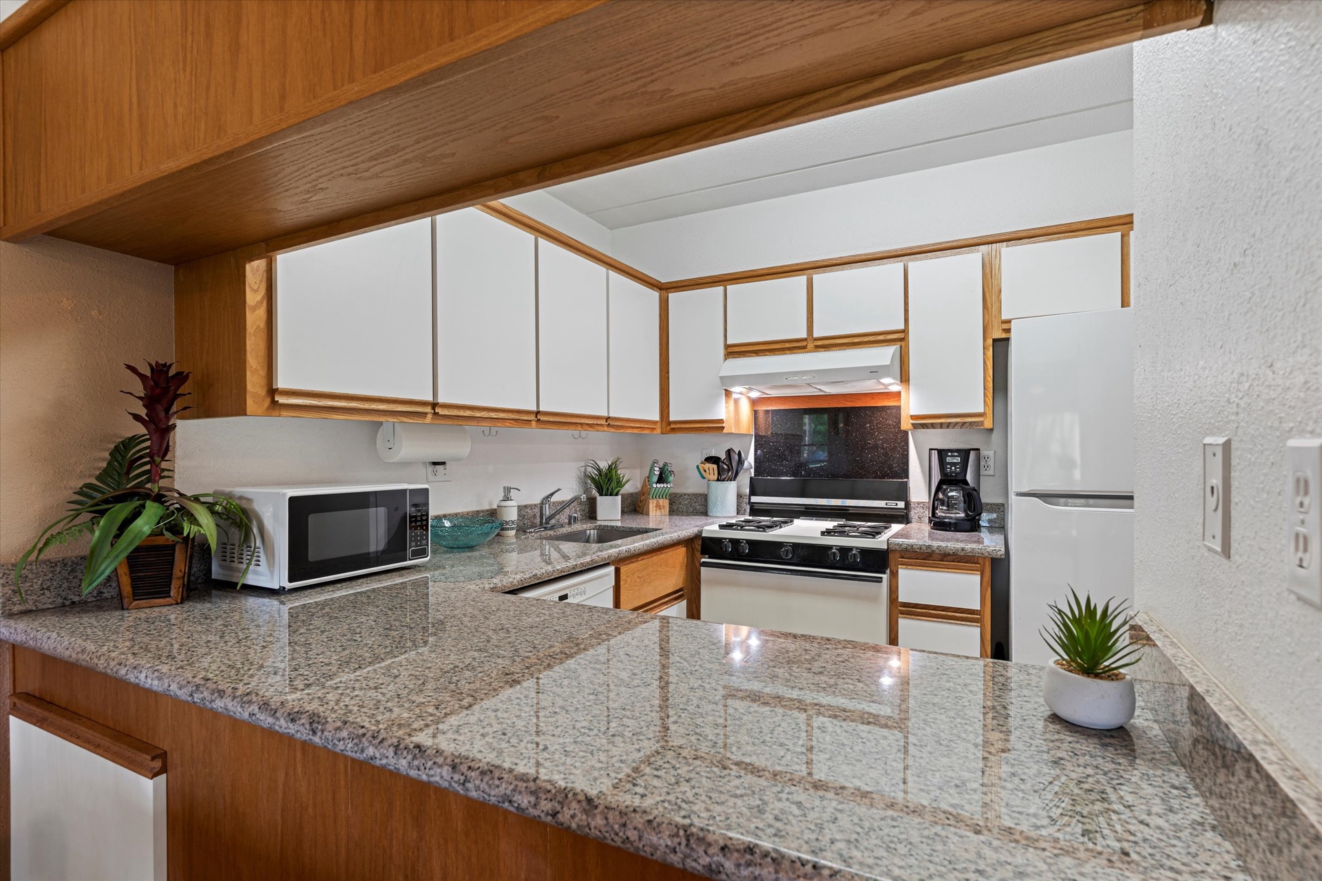 Your fully equipped kitchen features granite countertops, a gas range, and all the appliances you need to prepare delicious meals during your stay.