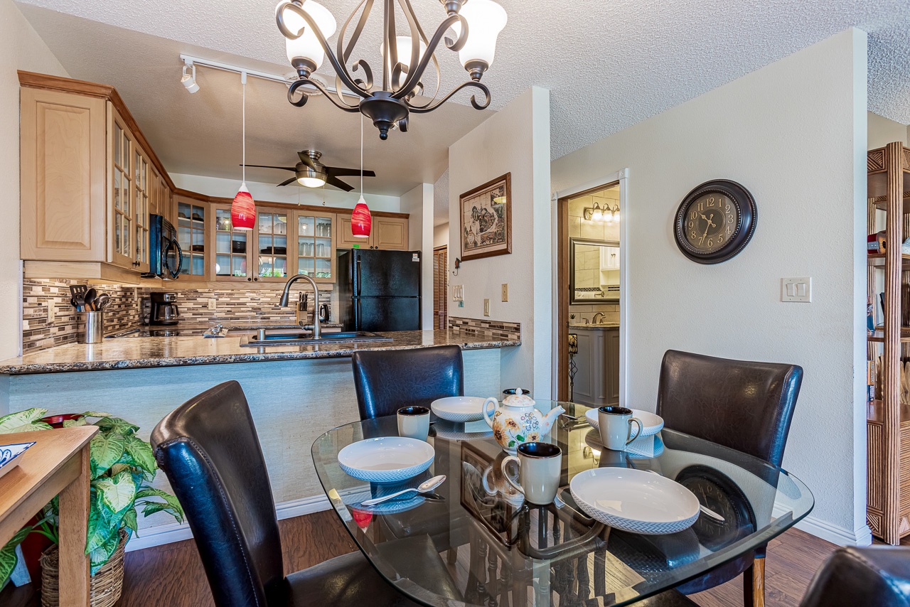 Gather around your elegant glass dining table while the chef in your group creates memories in the open-concept kitchen.