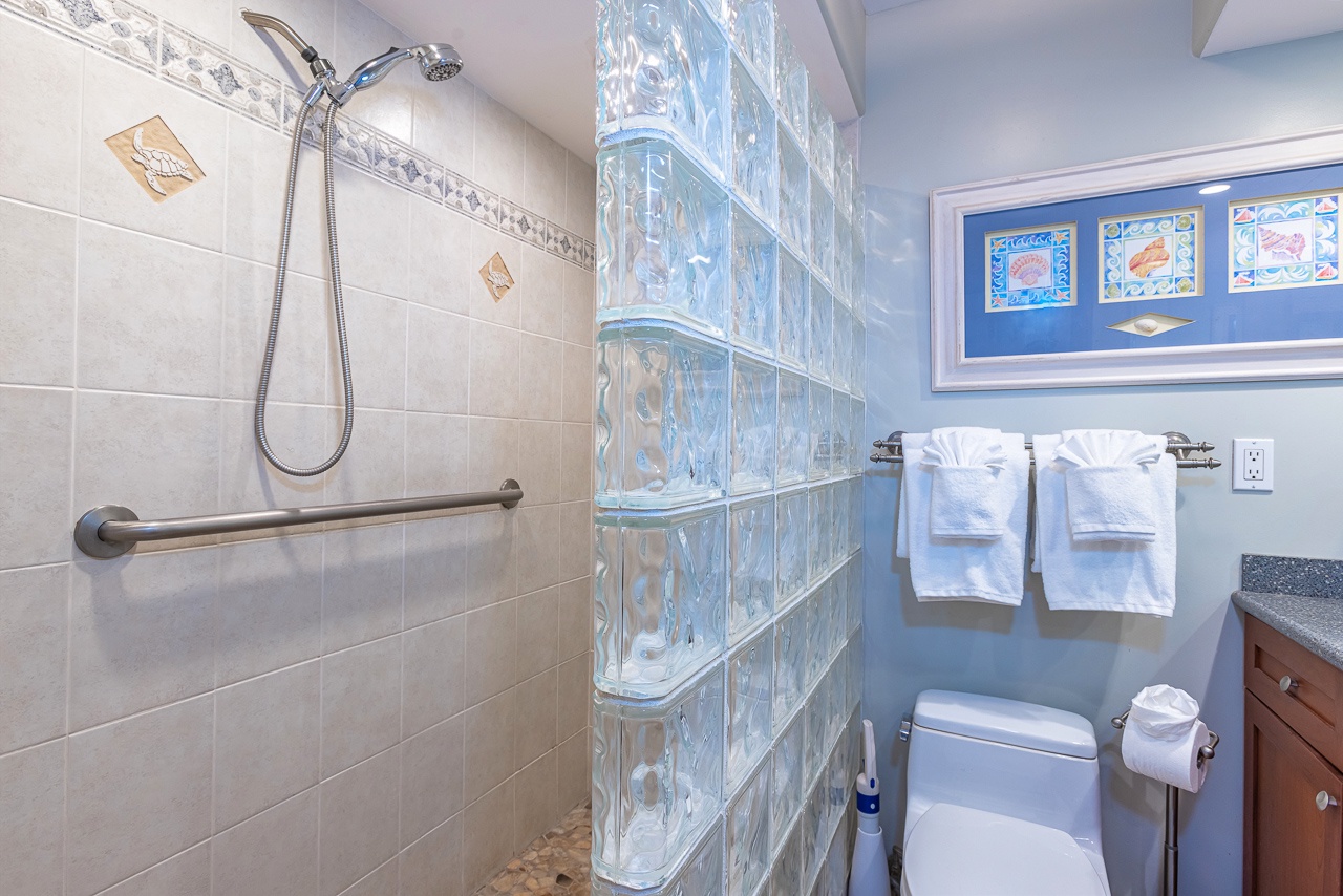Refresh in your private spa-like bathroom, complete with a walk-in shower, soothing coastal touches, and plush towels awaiting you.