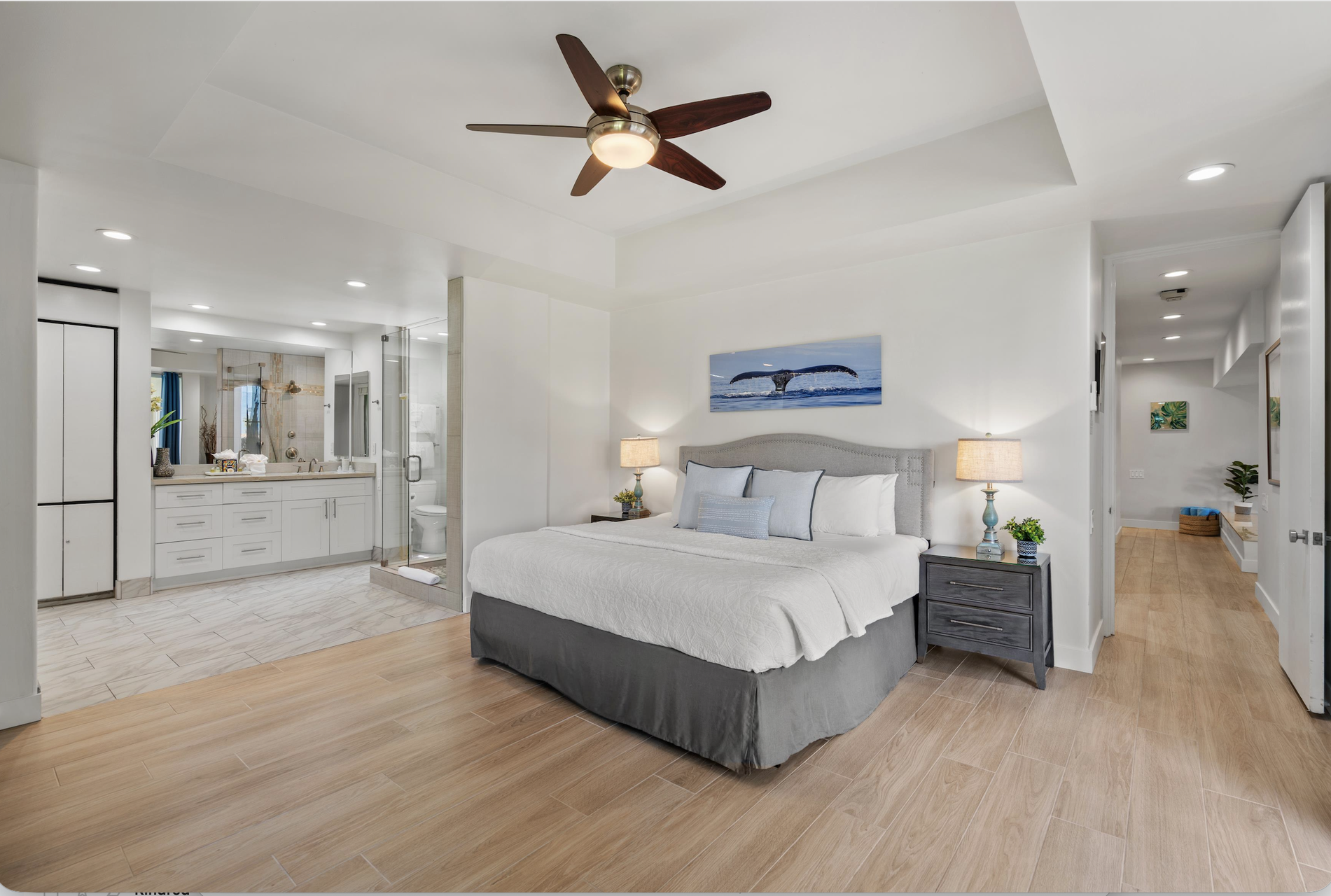 Drift off in your peaceful bedroom retreat, where plush bedding and stylish coastal touches create a serene sanctuary for your well-deserved rest.
