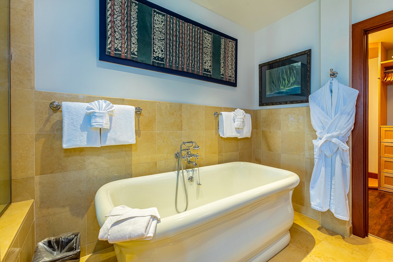 Sink into this elegant soaking tub after a day of exploring. Fluffy towels, a plush robe, and serene decor create your own private spa retreat.