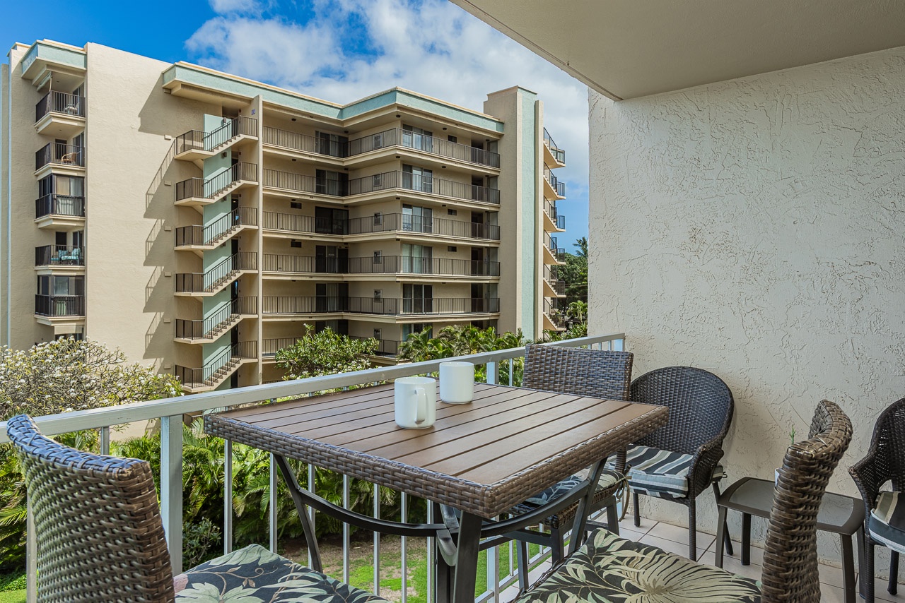 Enjoy morning coffee on your private balcony with garden views.