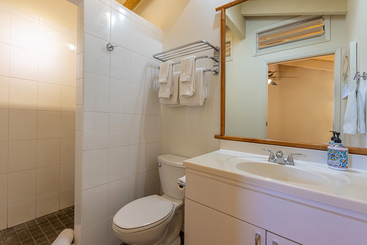 Step into your bright, private bathroom—fluffy towels await, the shower is refreshed and ready, and everything feels clean and welcoming after a day of adventure.