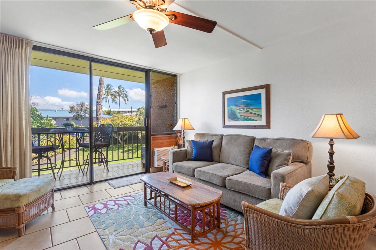 Unwind in your bright, breezy living space with island-inspired décor and a ceiling fan keeping you cool. Step right out to your private balcony and take in tropical greenery and a serene glimpse of the ocean just beyond.