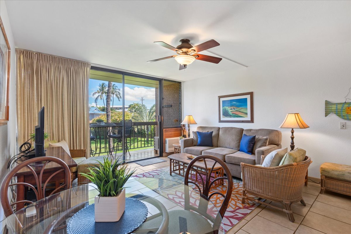Step into your bright, welcoming living space with cozy tropical touches and a private balcony that opens to swaying palms and island breezes.