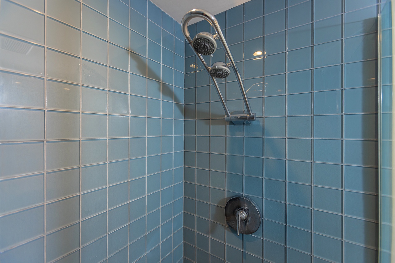 Modern primary bathroom with walk-in showers